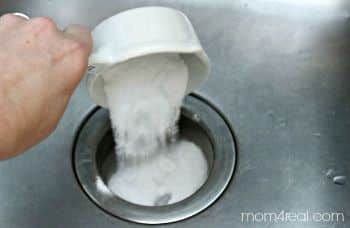 Clearing gunk from bathroom sink via sprinkled baking soda