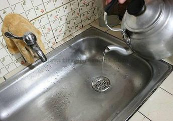 Removing gunk from sink drain by Boiling water and dishwashing liquid