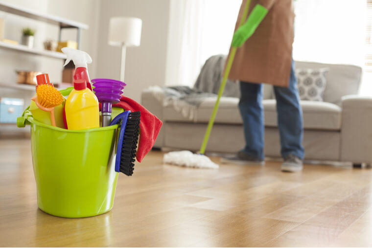 Man holding mop and plastic bucket Man holding mop and plastic bucket