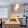 Modern, bright, clean, kitchen interior with stainless steel appliances in a luxury house