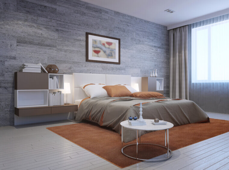 View of modern bedroom interior. Luxury double bed with white headboard and furniture mounted on both sides in white and taupe colors. View of modern bedroom interior. Luxury double bed with white headboard and furniture mounted on both sides in white and taupe colors.