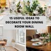 White flowers in black vase next to glass container with wine corks on dining table