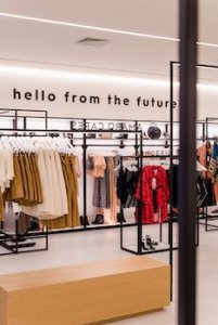 Clothes displayed on racks in a boutique