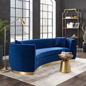 A blue curved sofa 