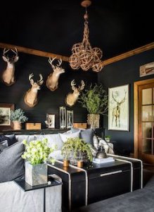 An animal hide rug next to a brown leather sofa