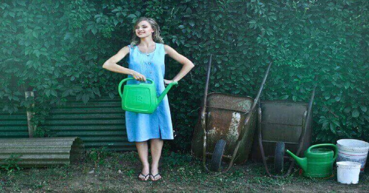 A woman Holding watering can