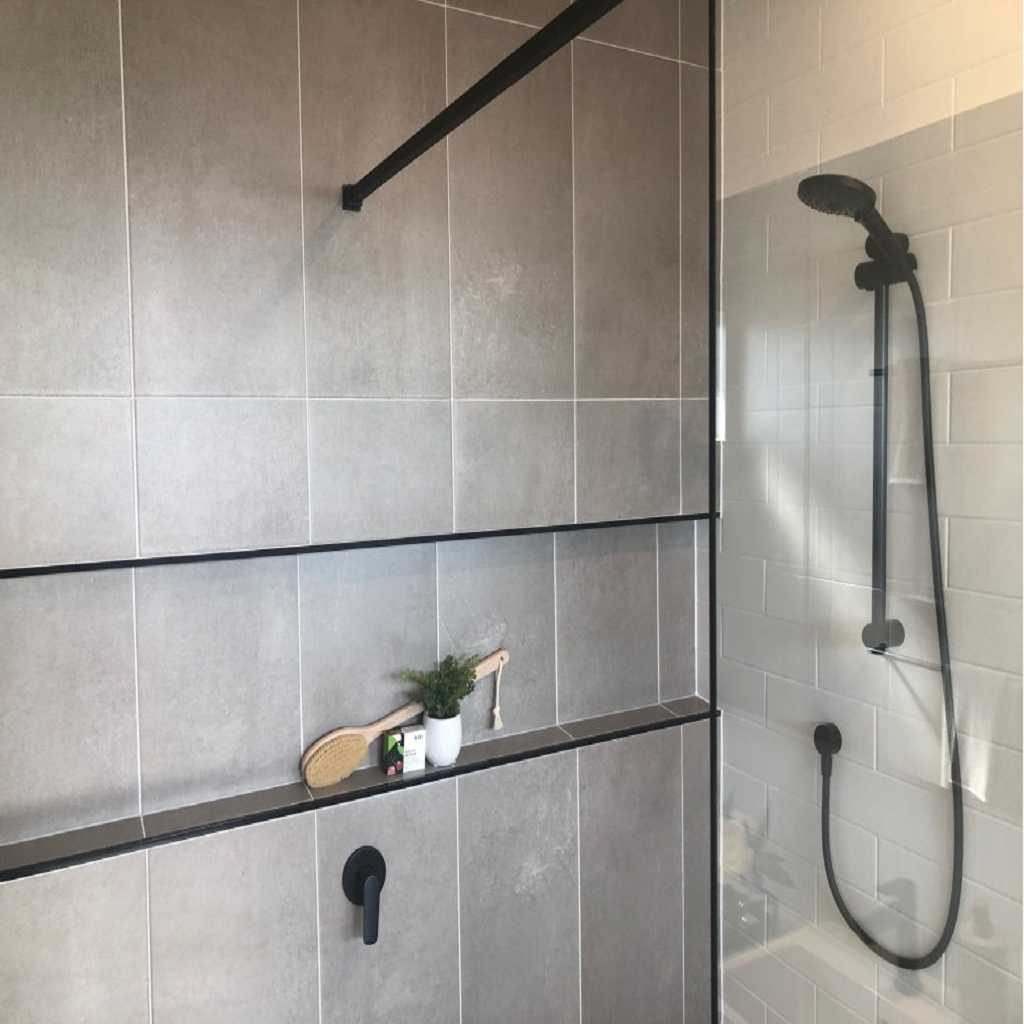 Built-in shower shelf with bathing essentials Built-in shower shelf with bathing essentials