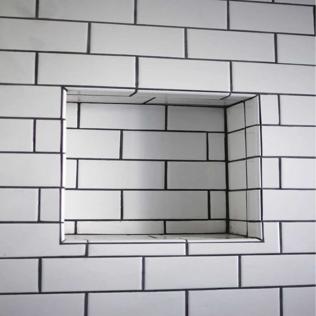 Shower niche shelf with tiles