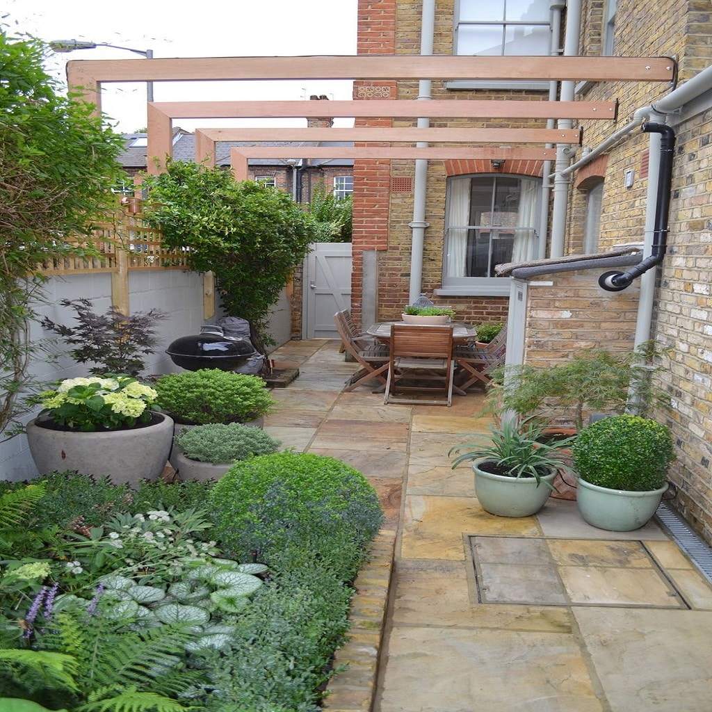 Side yard with various pot designs and plants Side yard with various pot designs and plants
