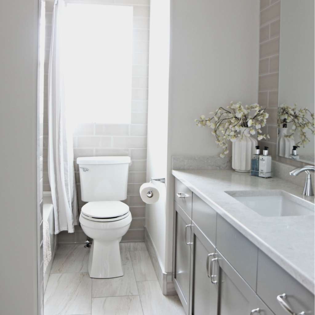 A bathroom with grey-painted cabinets A bathroom with grey-painted cabinets