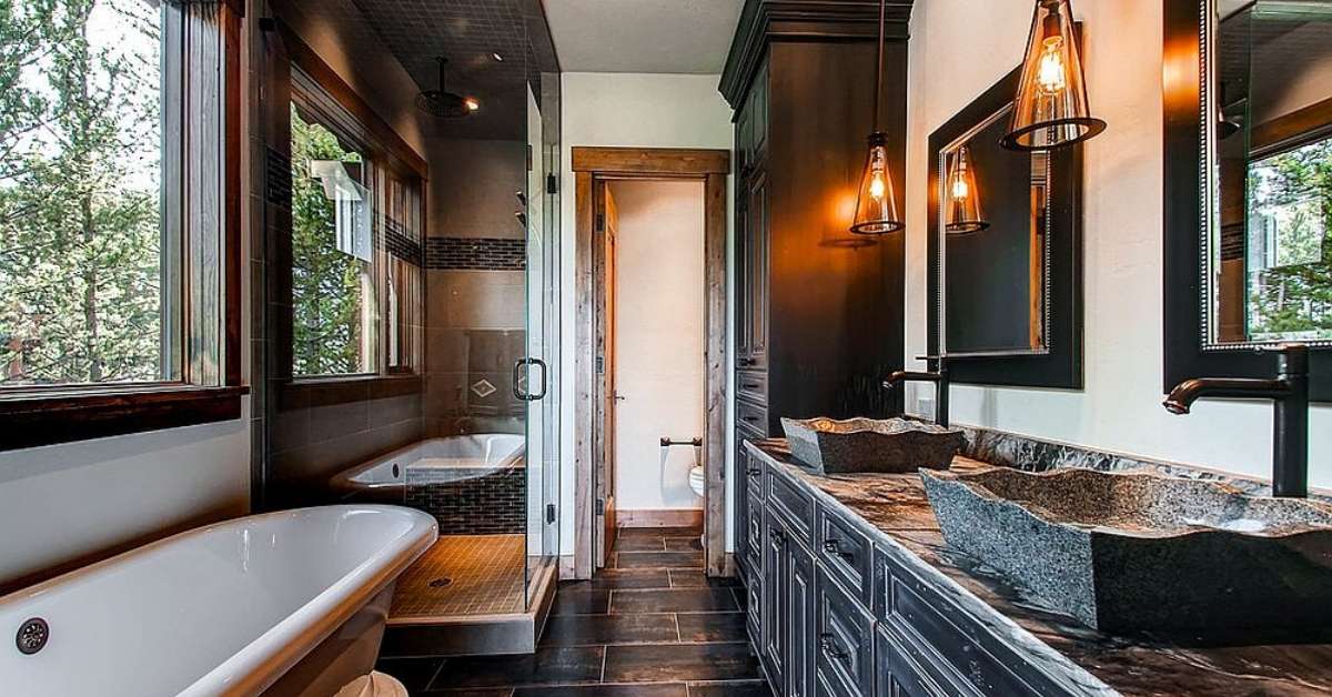 A dark-themed rustic bathroom