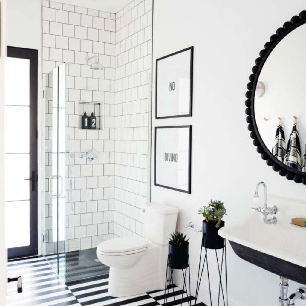 A modern bathroom with black-and-white layout