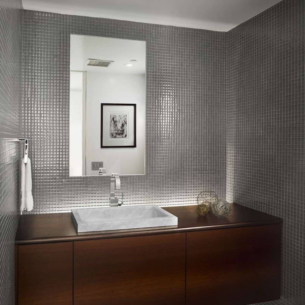 A simple yet elegant floating vanity in a small bathroom