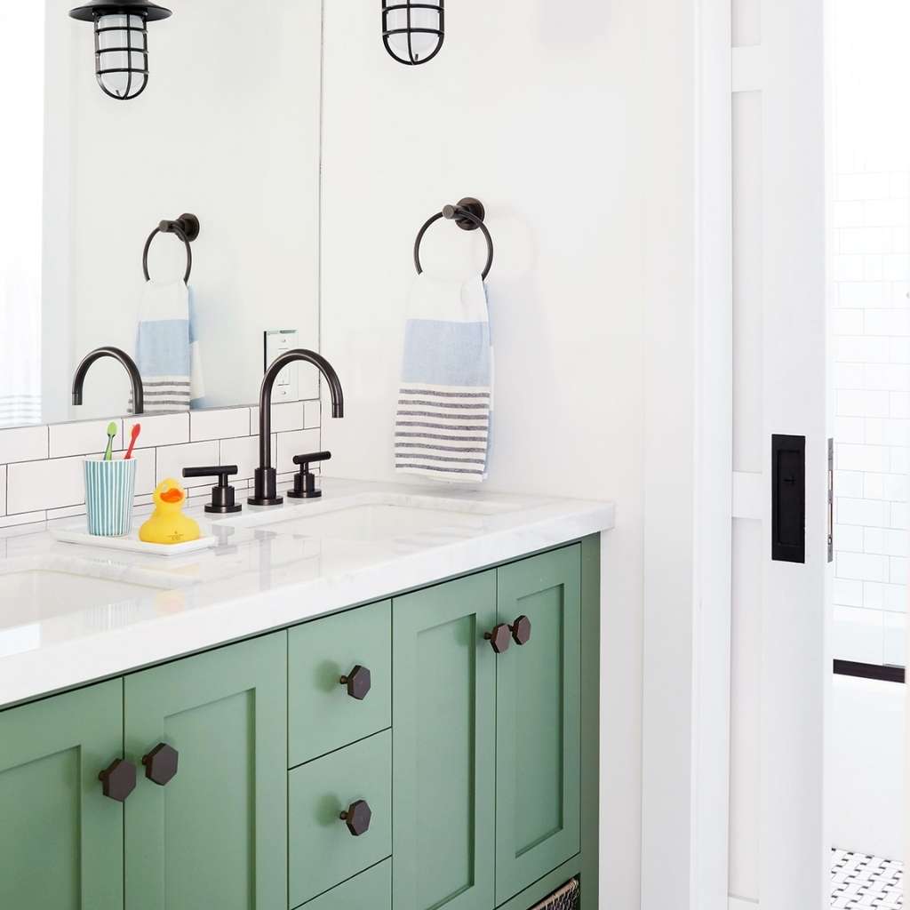 A single sink bathroom with multiple drawers and shelves A single sink bathroom with multiple drawers and shelves