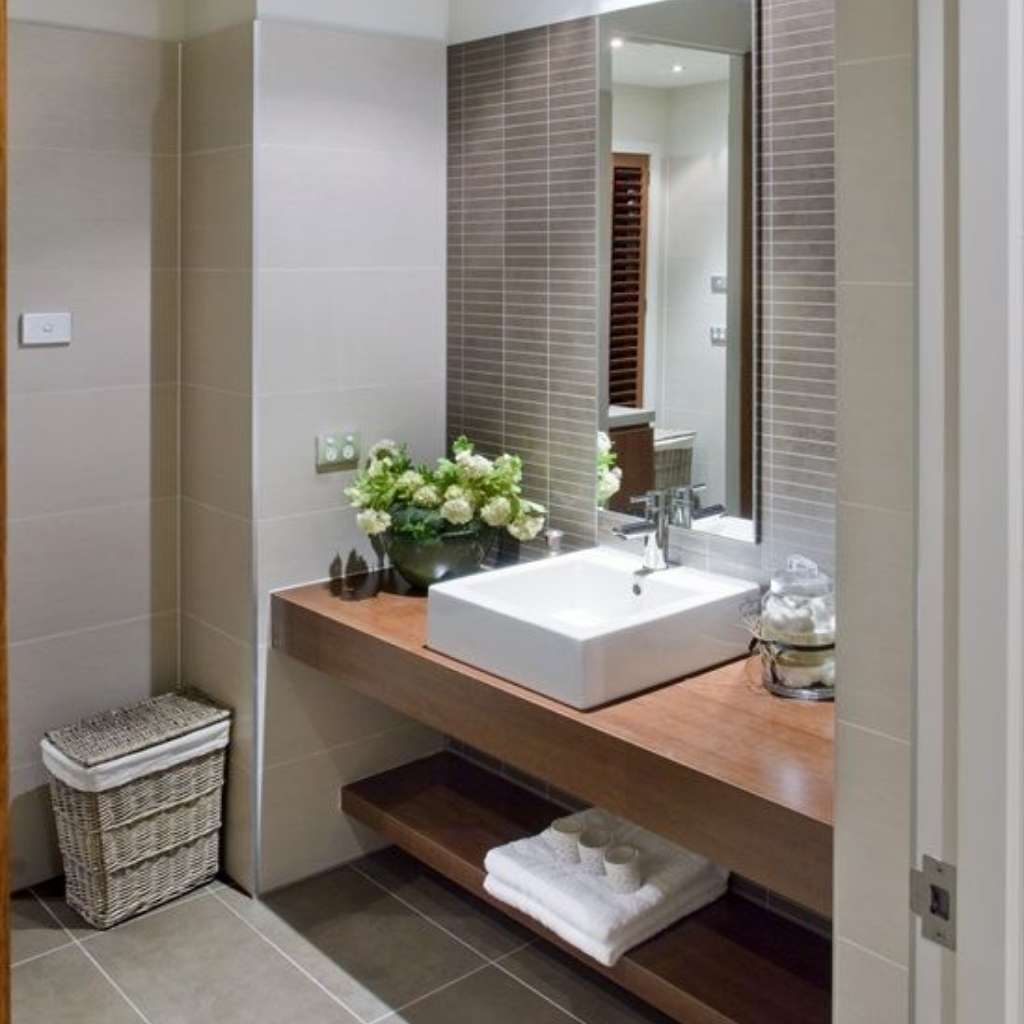 A sleek, neutral bathroom with earthy theme A sleek, neutral bathroom with earthy theme