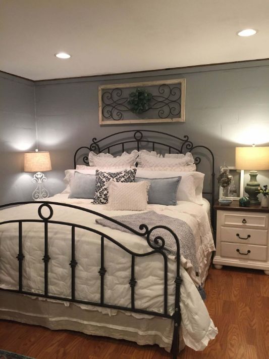 Black Steel Frame Bed In Farmhouse Bedroom