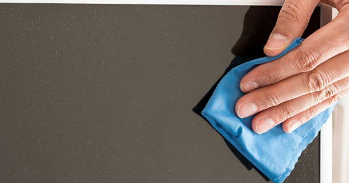 a man cleaning a vizio flat screen tv a man cleaning a vizio flat screen tv