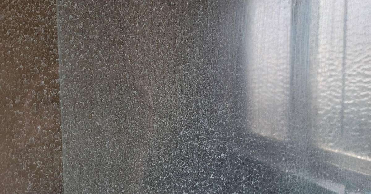 Image showing a stained/dirty shower screen Image showing a stained/dirty shower screen