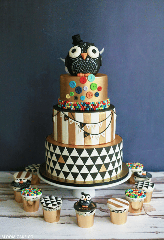 Owl-themed birthday party cake in black, gold, and white Owl-themed birthday party cake in black, gold, and white