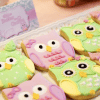 Image Source: Party Doll Manila Alt image text: Owl-shaped cookies in colors pink and green
