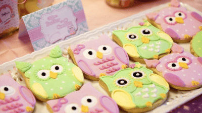 Image Source: Party Doll Manila Alt image text: Owl-shaped cookies in colors pink and green