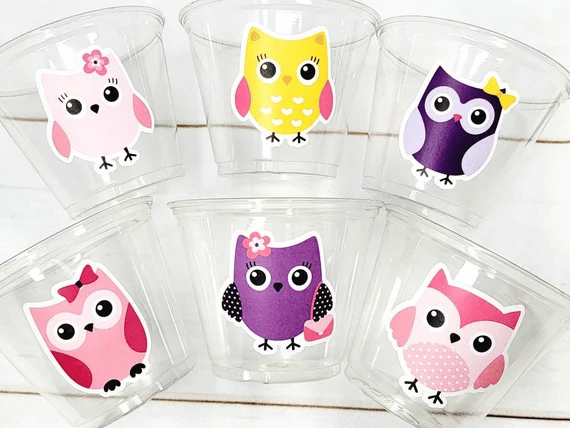 Owl-themed birthday party cups in various colors Owl-themed birthday party cups in various colors