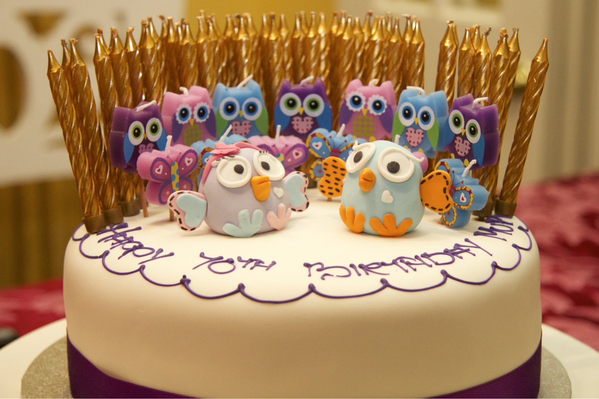  Owl-themed birthday candles in various colors