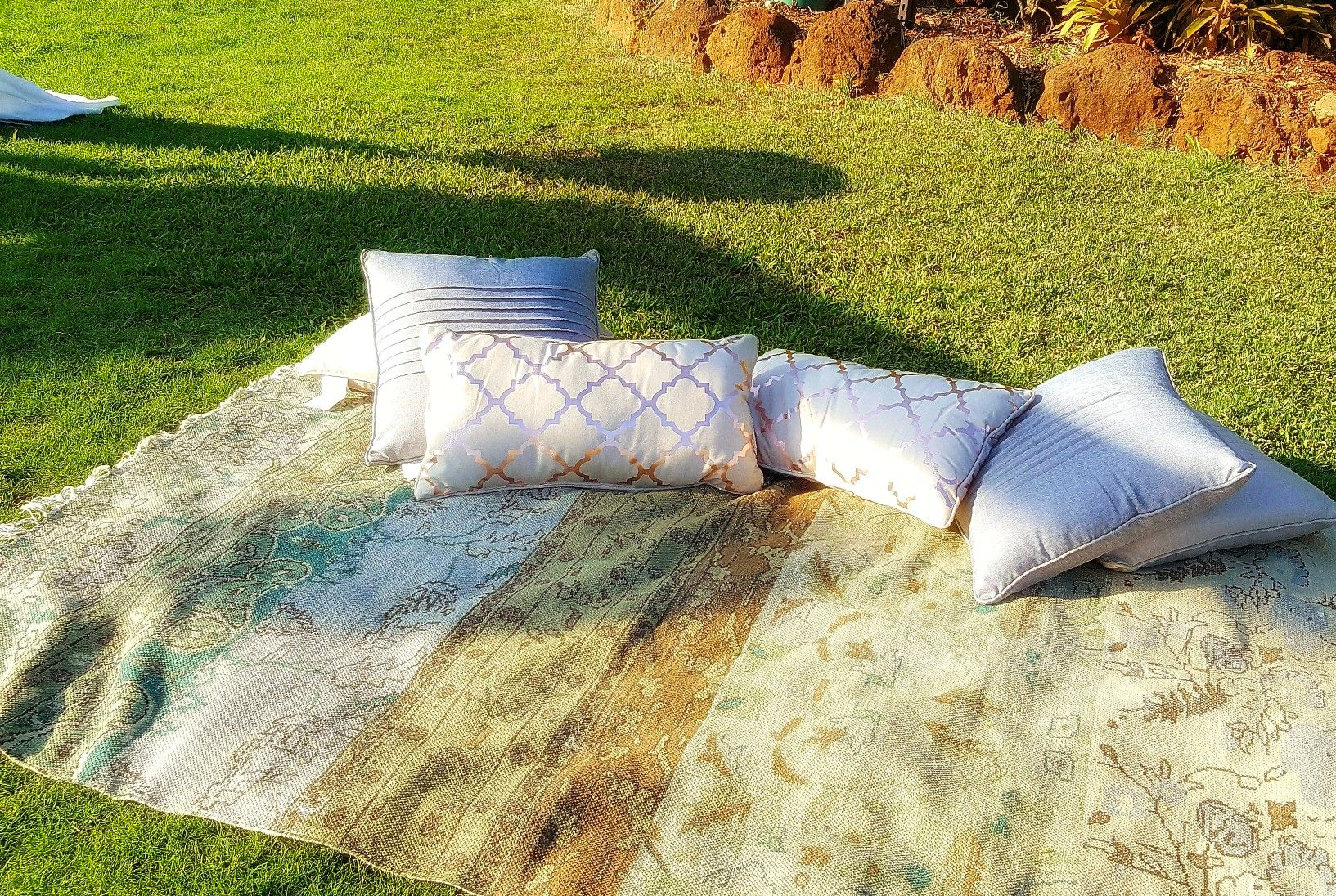 Outdoor pillows and blankets for a backyard movie night