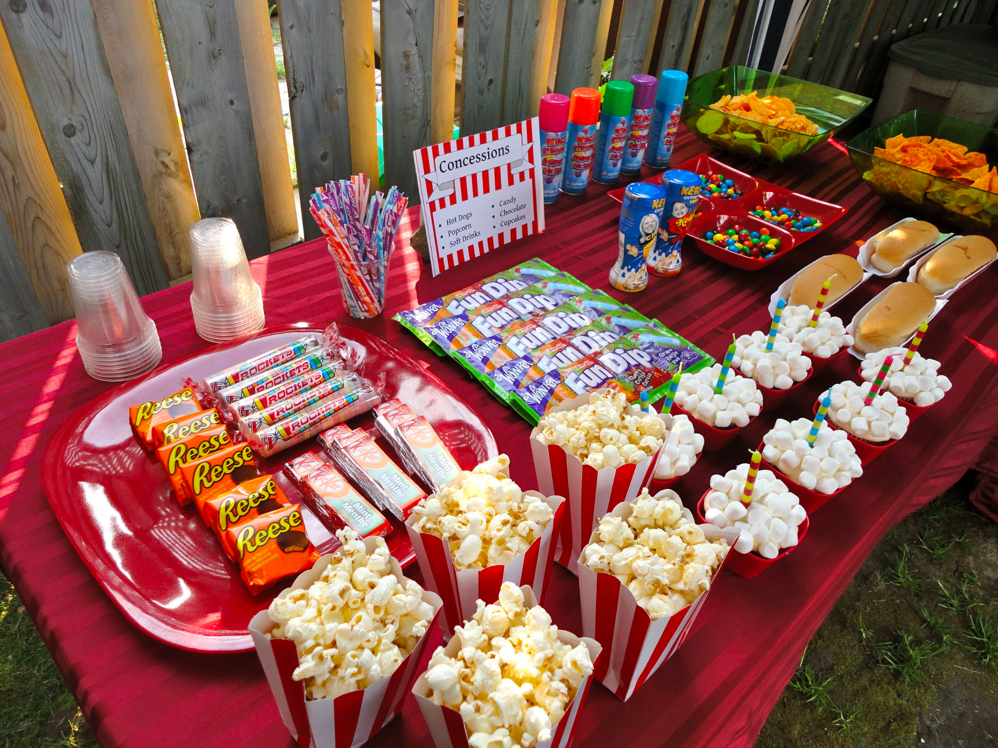 A backyard movie night with a wide variety of snacks