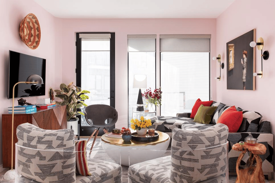 A combination of pink, gray, and black decors in living room