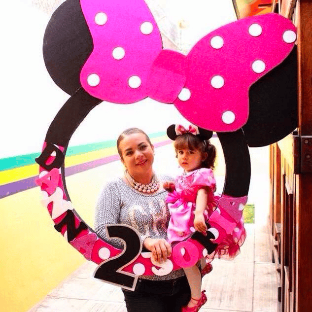Minnie-mouse-themed photo booth for a birthday party