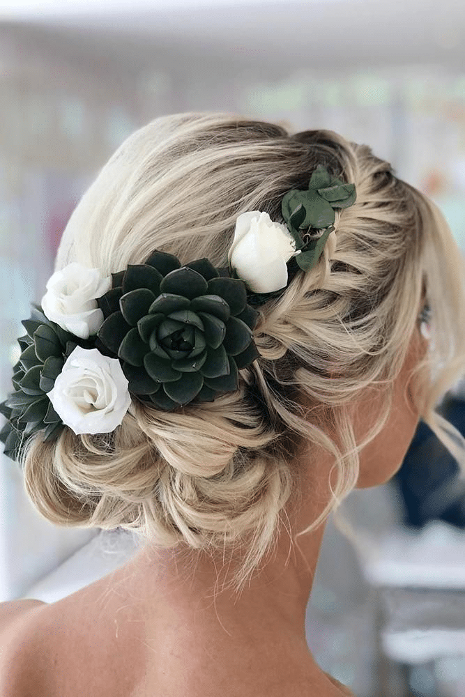 Embedding succulents in bride’s hairstyle