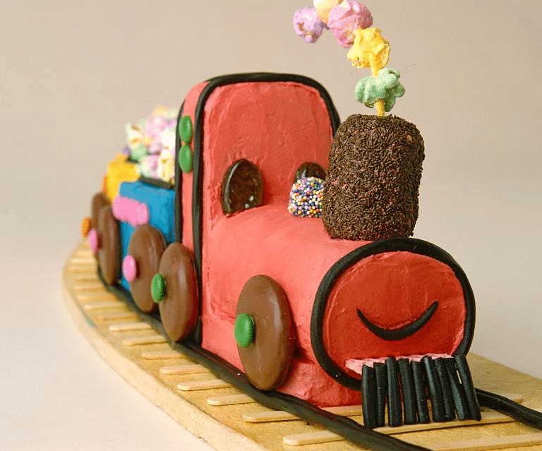 A vintage train-themed birthday party cake