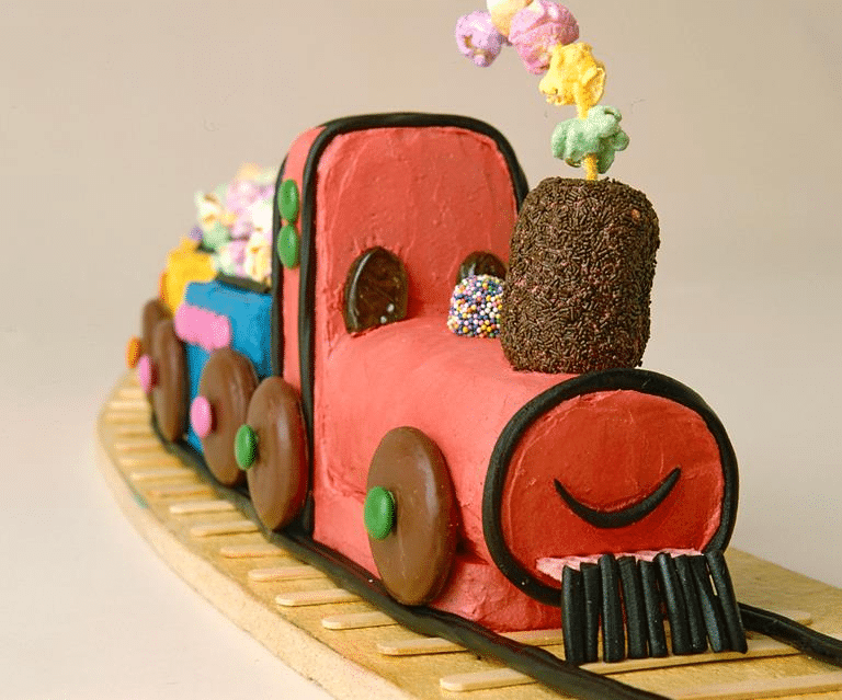 A vintage train-themed birthday party cake A vintage train-themed birthday party cake