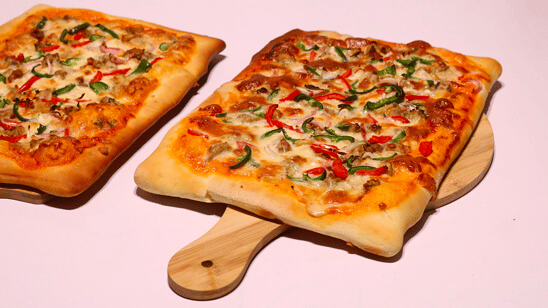 A vintage train-themed birthday party pizza A vintage train-themed birthday party pizza