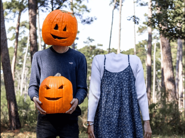 Halloween-themed photoshoot for a couple in pumpkin costumes Halloween-themed photoshoot for a couple in pumpkin costumes