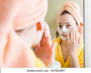 Applying face pack or face mask or face solution Applying face pack or face mask or face solution